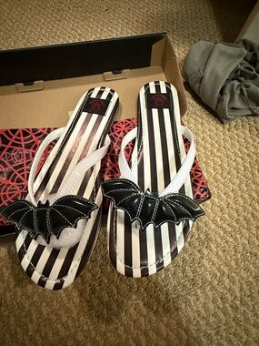 Striped Black & White Bat Accent Flip-Flop Sandals